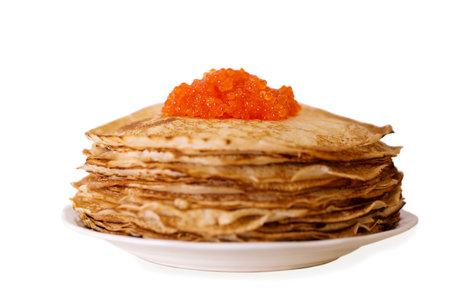 Delicious thin ruddy pancakes with red caviar isolated on white backgroundの写真素材
