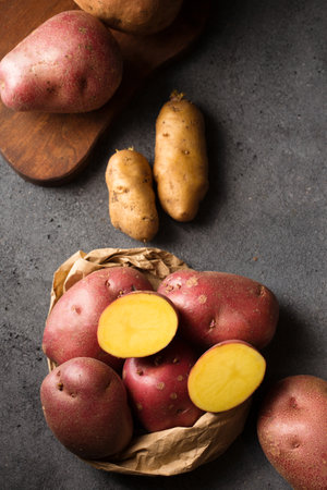 Various varieties of potatoes. Germination of sprouts on potatoes for planting in the groundの写真素材