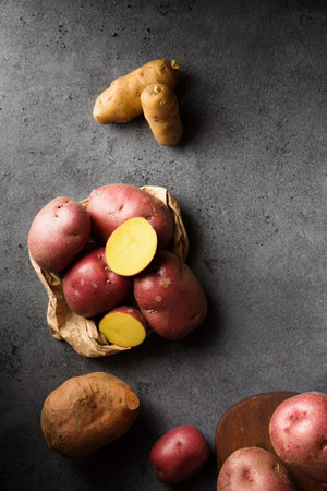 Various varieties of potatoes. Germination of sprouts on potatoes for planting in the groundの写真素材