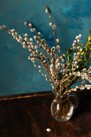 a spring bouquet, flowering willow and boxwood in a decanterの写真素材