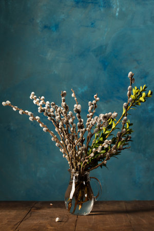 a spring bouquet, flowering willow and boxwood in a decanterの写真素材