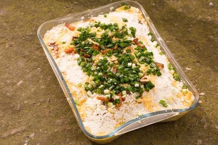 Banosh, or tokan Hutsul cuisine. Corn porridge with cream, sheep cheese, cracklings and green onionsの写真素材
