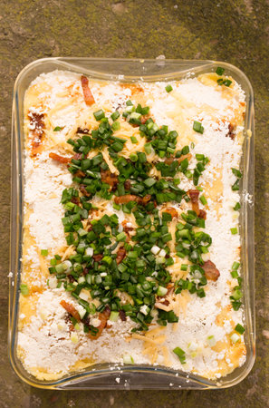 Banosh, or tokan Hutsul cuisine. Corn porridge with cream, sheep cheese, cracklings and green onionsの写真素材