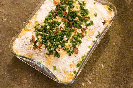 Banosh, or tokan Hutsul cuisine. Corn porridge with cream, sheep cheese, cracklings and green onionsの写真素材