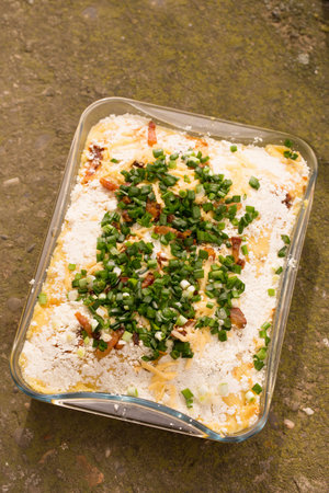 Banosh, or tokan Hutsul cuisine. Corn porridge with cream, sheep cheese, cracklings and green onionsの写真素材