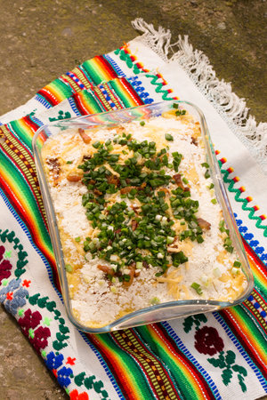 Banosh, or tokan Hutsul cuisine. Corn porridge with cream, sheep cheese, cracklings and green onionsの写真素材