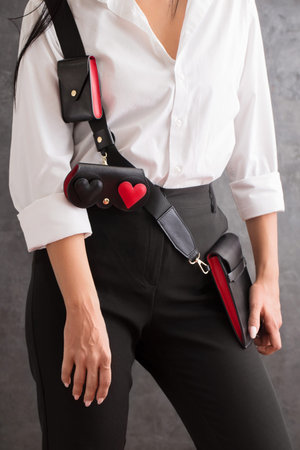 Woman with smartphone bag, glasses case and a wallet for credit cards, close up photo