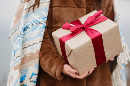 A young woman is holding a box in her hands. Valentine's day concept