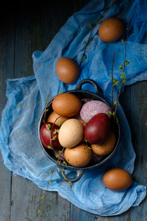 Still life with eggs in a blue bowl on a wooden background, rustic styleの写真素材