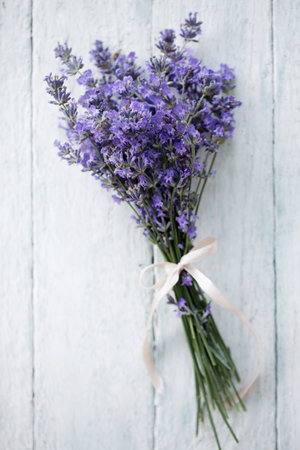 A bouquet of fresh, fragrant lavender on a wooden backgroundの写真素材
