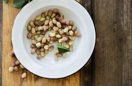 Delicious sweet white mulberry in a metal bowlの写真素材