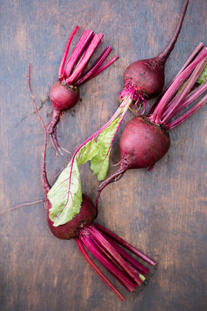 Fresh organic beets, with tops in a bowlの写真素材