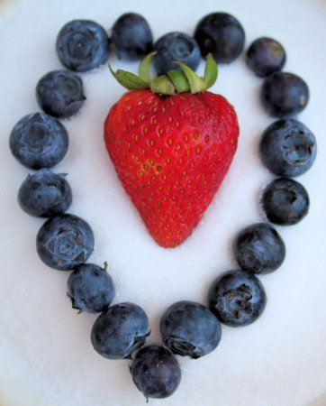 Sweet Berries Shaped as Colorful Heartの写真素材