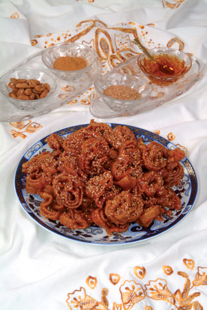 Chebbakia, Cake, cookies served with tea offered at the wedding, Ramadan, and Eid al Fitr.