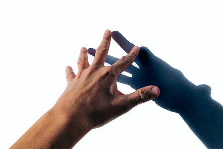 Hand of man and woman holding each other isolated on white background.の写真素材