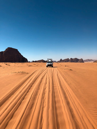 Off road car in the desert of Wadi Rum, Jordan.