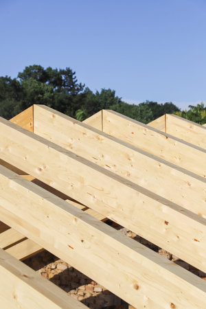 Roofing of a new house with wooden roof trussesの写真素材