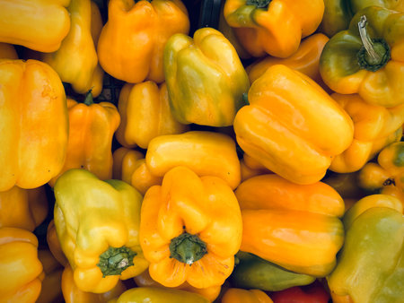 Yellow bell pepper on the counter in the market. Close-up.の写真素材