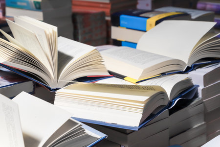 Stack of books on the table in the library. Selective focus.の写真素材