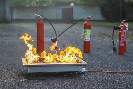 Fire extinguisher on the street. Firefighting equipment in action.