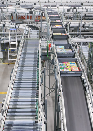 Conveyor belt in a factory, note shallow depth of fieldの写真素材