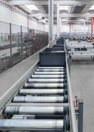 packing line in a logistics warehouse. conveyor belt in a modern production line