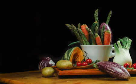 mixed vegetables on a table with black background