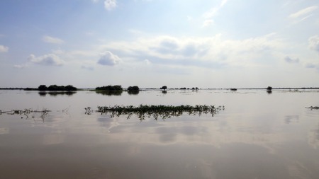 Sky reflected in water, Tonle Sapの写真素材