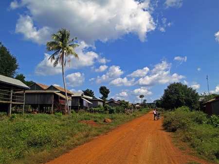Cambodian village next to dusty roadの写真素材