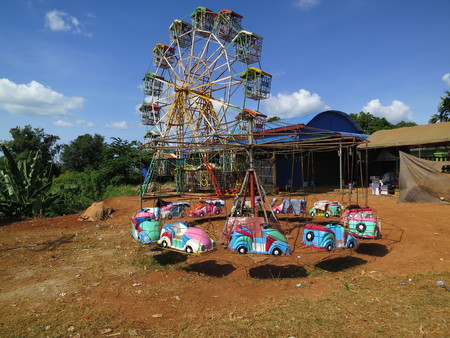 giant wheel and carousel in Banlung, Cambodiaの写真素材