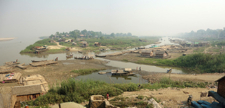 Slum village near the river in the Mandalay city in Myanmar (Burma)の写真素材