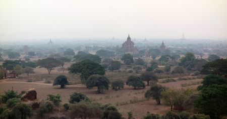 Amazing misty sunrise colors and silhouette of ancient Pagodas, Bagan, Myanmarの写真素材