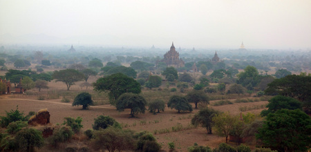 Amazing misty sunrise colors and silhouette of ancient Pagodas, Bagan, Myanmarの写真素材