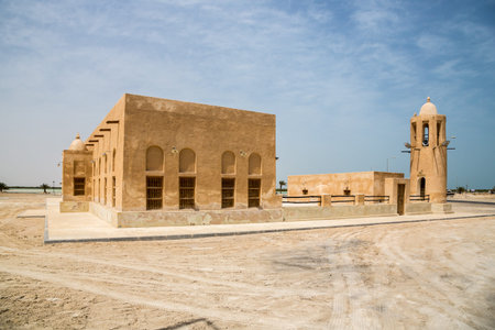 Historical old Mosque with a Minaret in Al Thakhira (Al Dhakira), Qatar, built from coral rock and...