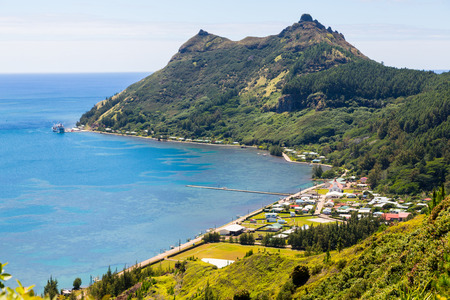 View of Ahurei village in AhurÃ©i bay from above, with an unloading ship in the port, Rapa Iti island, Bass Islands (Austral group, Tubuai archipelago), French Polynesia, Oceania, South Pacific Oceanの写真素材