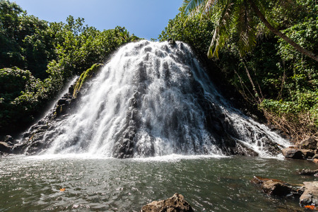 Kepirohi Waterfall in a jungle with palm trees around, near Nan Madol ruins, Pohnpei island, Federated states of Micronesia, Oceania.の写真素材