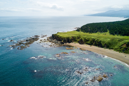 Aerial drone photo of cape Velikan (near by cape Ptichiy), Sakhalin island, Russia (Sahalin). Unbelievable natural green lawns.の写真素材