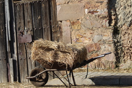 Former truck with straw after a hard workの写真素材