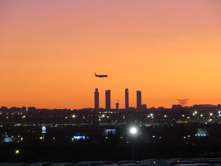 Beautiful photo of a plane landing at the airport in Madrid Spainの写真素材