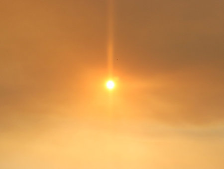 sun extinguished by the smoke of the fires heat