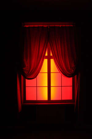 red and yellow window with black backgroundの写真素材