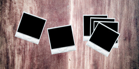 Group of polaroids randomly displaced over a textured wall