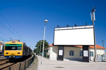 Giant white billboard near trainstationの写真素材
