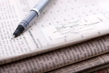 pile of financial newspapersの写真素材