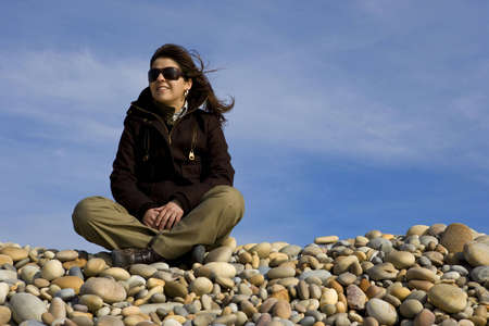 young woman contemplating the beachの写真素材