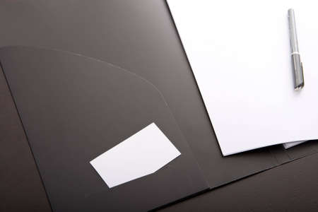corporate binder with white card and penの写真素材