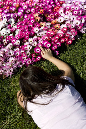 young woman caressing flower bouquetの写真素材