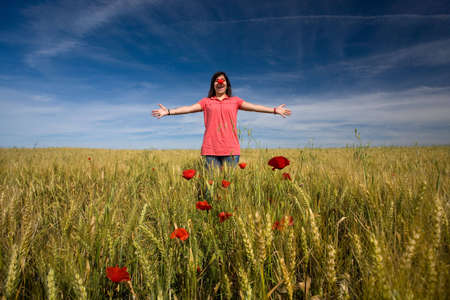 young girl with red clown nose outdoorsの写真素材