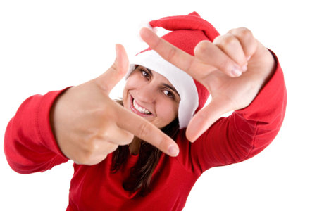 young santa woman in red costume doing a photo frame with her hands isolated on white backgroundの写真素材