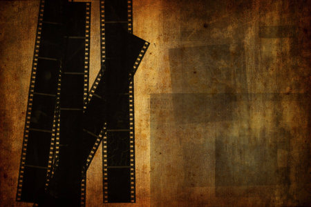 Grunge vintage background with used film stripsの写真素材